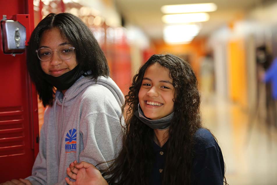 students and teacher working in classroom