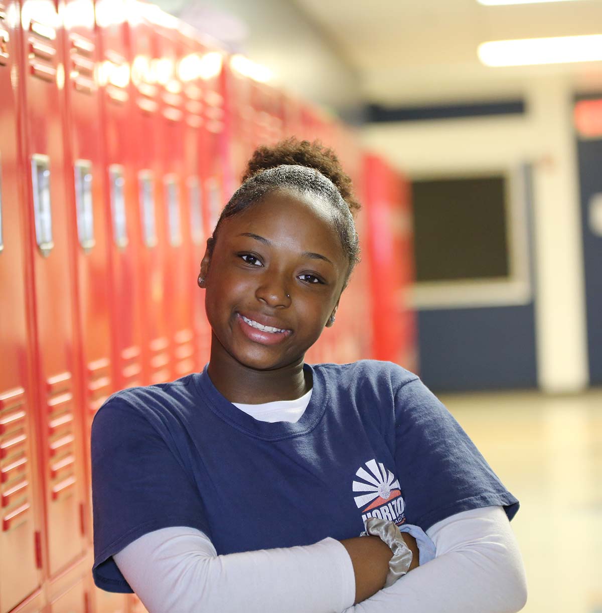Student drawing in a classroom.