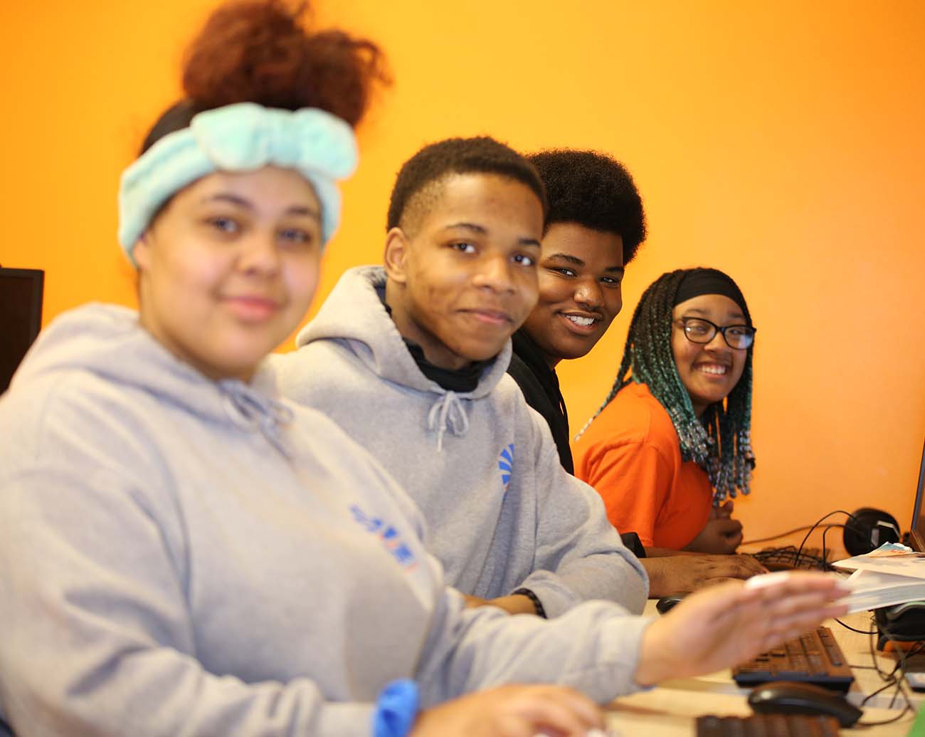 Teacher or school staff member warmly interacting with a student outside